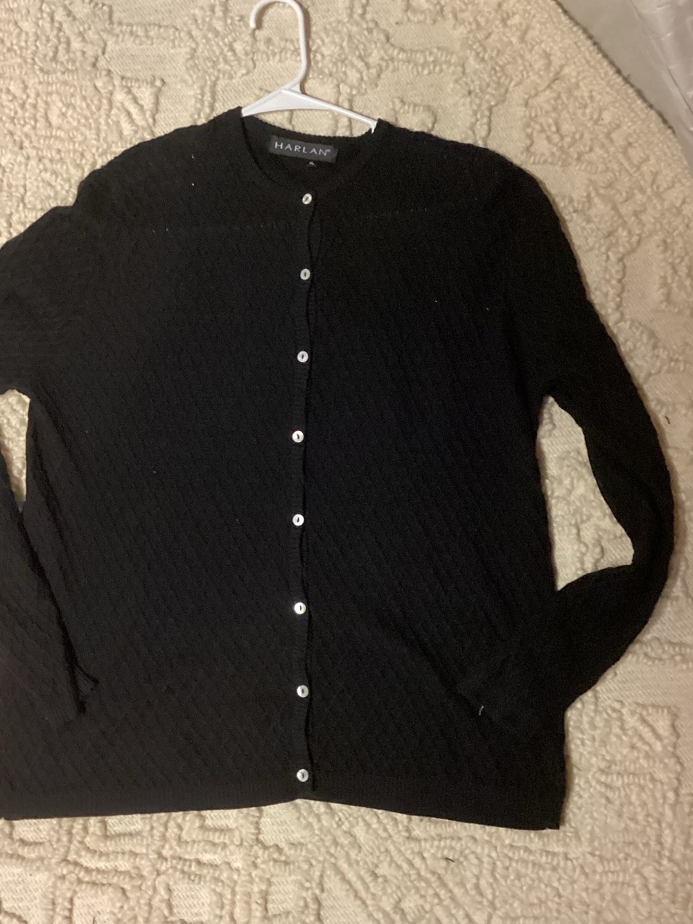 Black cardigan sweater, very soft.